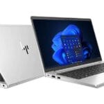 Ordinateur portable HP blanc et argent, écran affichant Windows 11, idéal pour technologie, bureautique, et utilisation professionnelle.