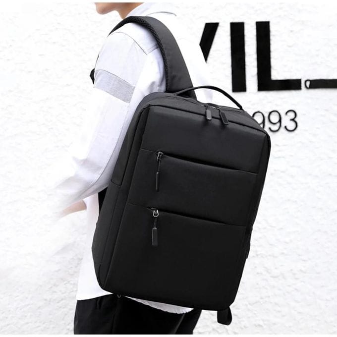 Sac à dos anthracite imperméable pour ordinateur portable avec port de charge USB porté à l'épaule - DestockAfric